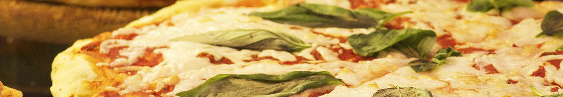 Eating Italian Pizza Sandwich at Gaslamp Pizza restaurant in San Diego, CA.